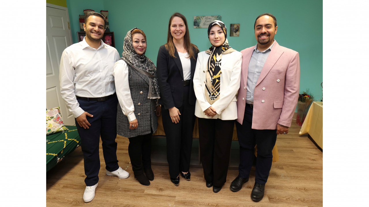 Photo of Education and Early Childhood Development Minister Becky Druhan with four people