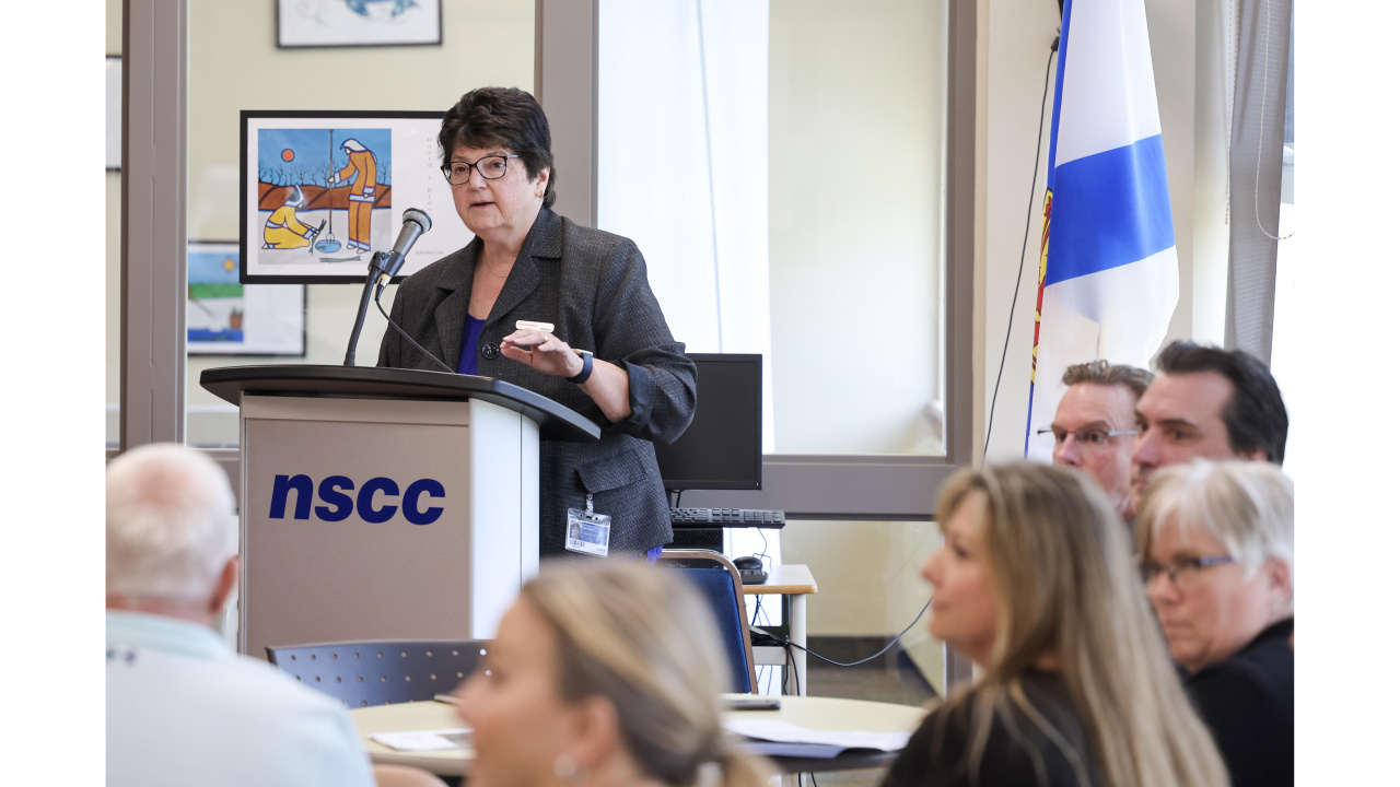 Photo of Mary Thompson, Principal of NSCC's Shelburne campus, at a podium