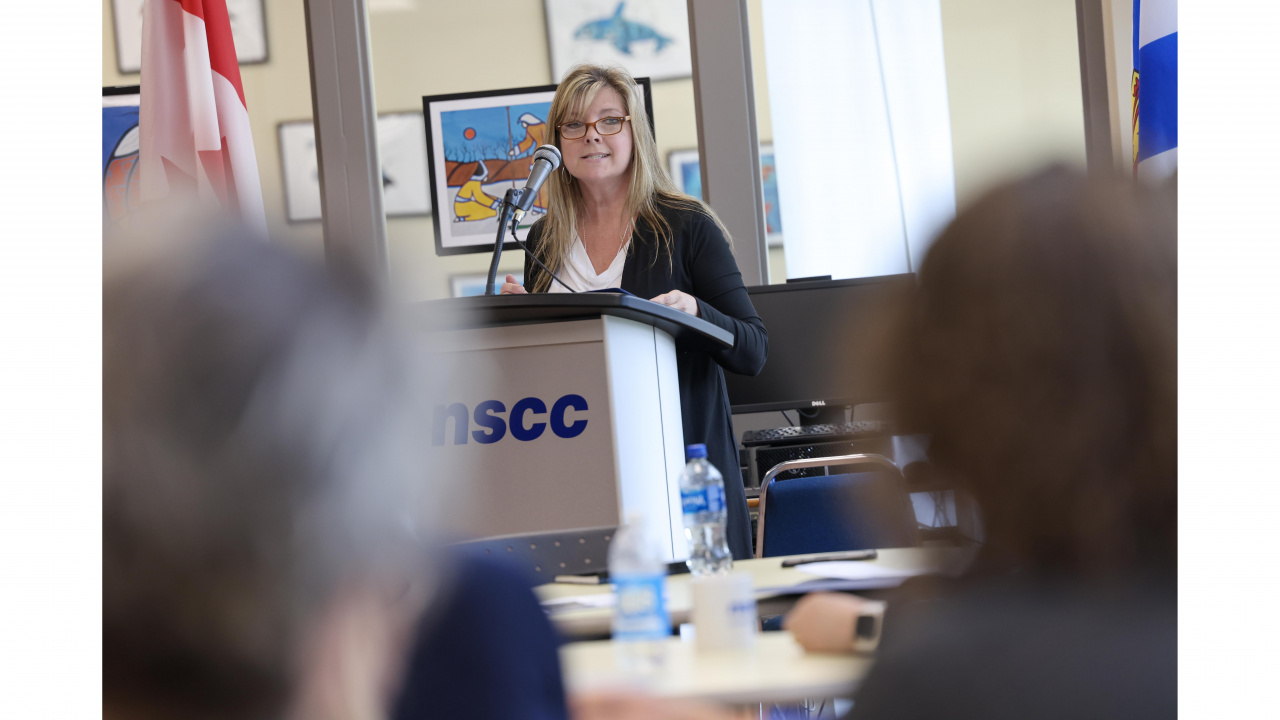 Photo of Penny Smith, Warden of the Municipality of Shelburne, at a podium