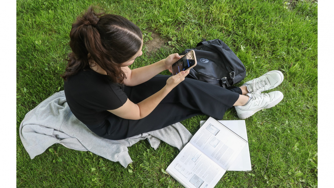 student with cell phone