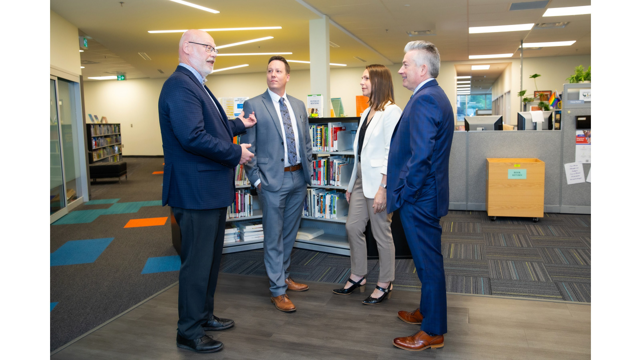 Photo of Education and Early Childhood Development Minister Becky Druhan with three officials