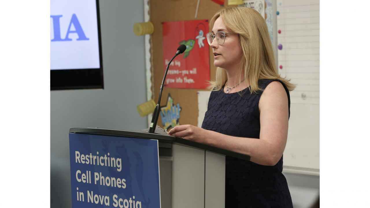 Photo of Sydney Houston-Goudge, a grade 8 teacher at Clayton Park Junior HIgh School, at a podium