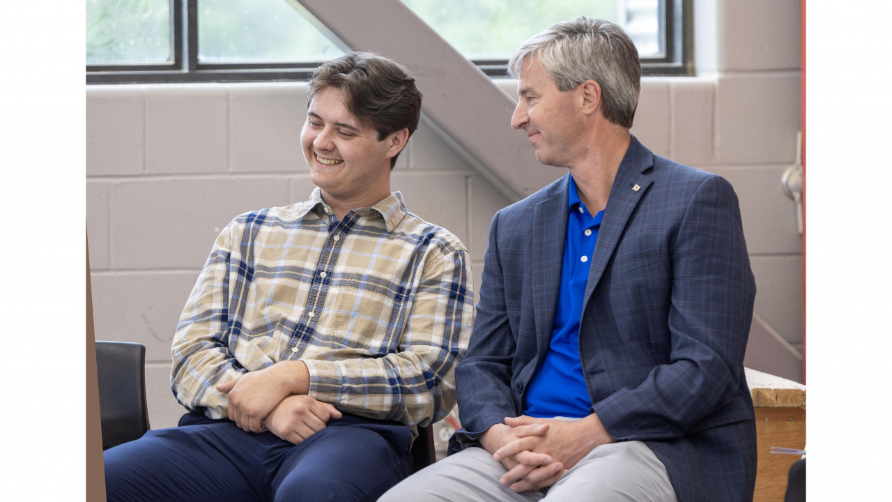 Premier Tim Houston with Brennan Reid, a student at Glace Bay High who is interested in a career in the skilled trades. (Communications Nova Scotia)