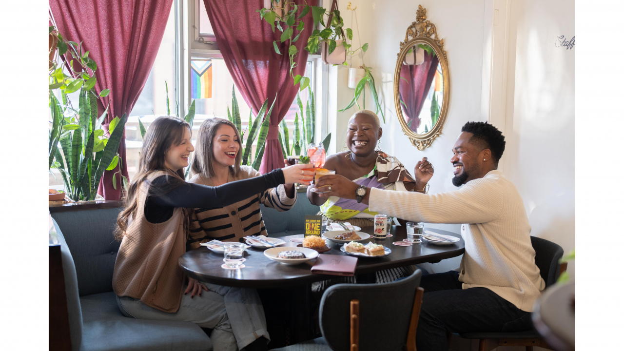 A marketing image featuring people enjoying themselves at Dear Friend Bar in Dartmouth during Dining Around, an annual culinary event.