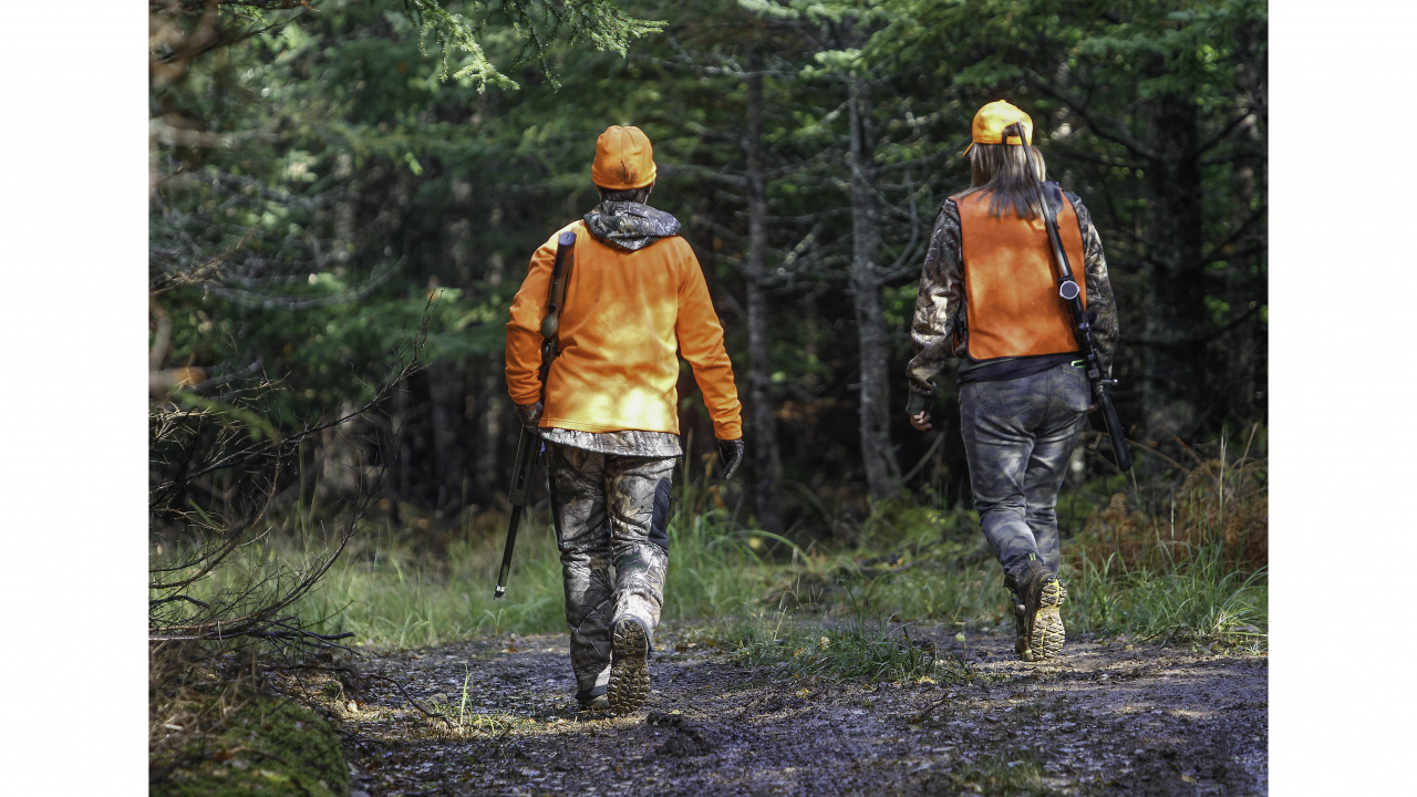 Photo of two hunters in the woods