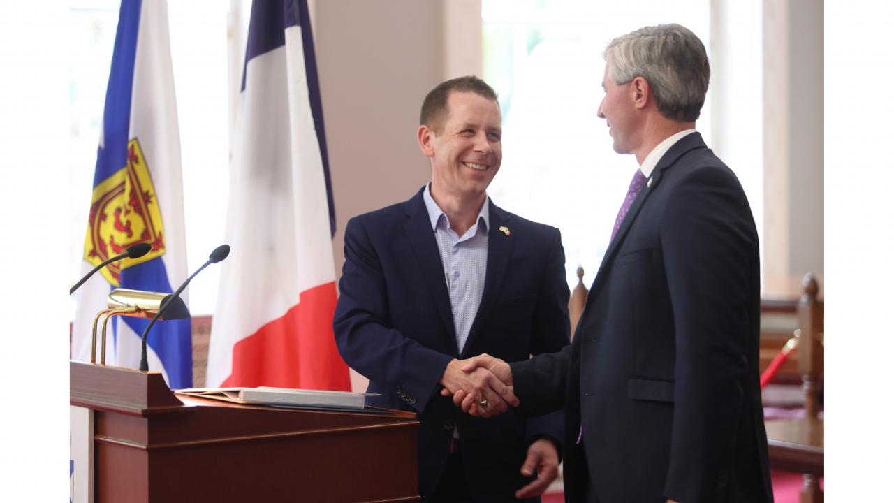 Acadian Affairs and Francophonie Minister Colton LeBlanc (left) and Premier Tim Houston proclaim August to be Acadian Heritage Month. (Communications Nova Scotia)