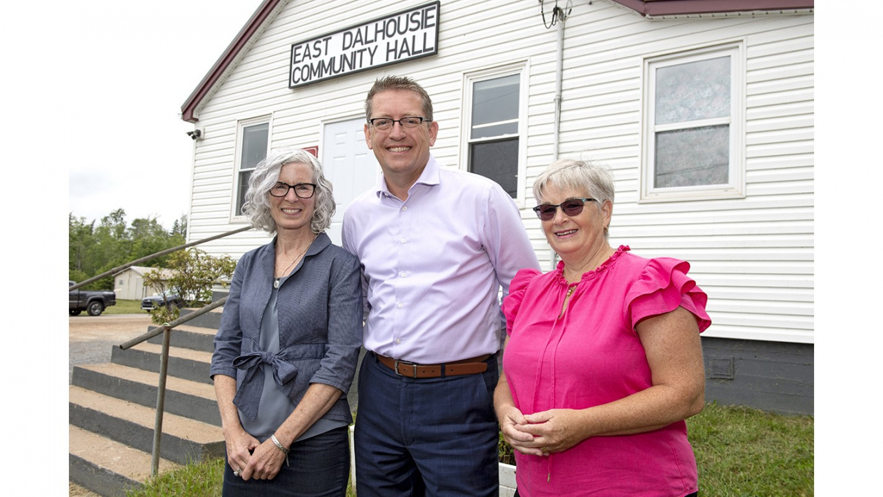 Photo of Debbie Nielsen from the Nova Scotia Federation of Municipalities, MLA of Kings West, Chris Palmer, and Susan MacDonald from the Lake Torment Stewardship Association