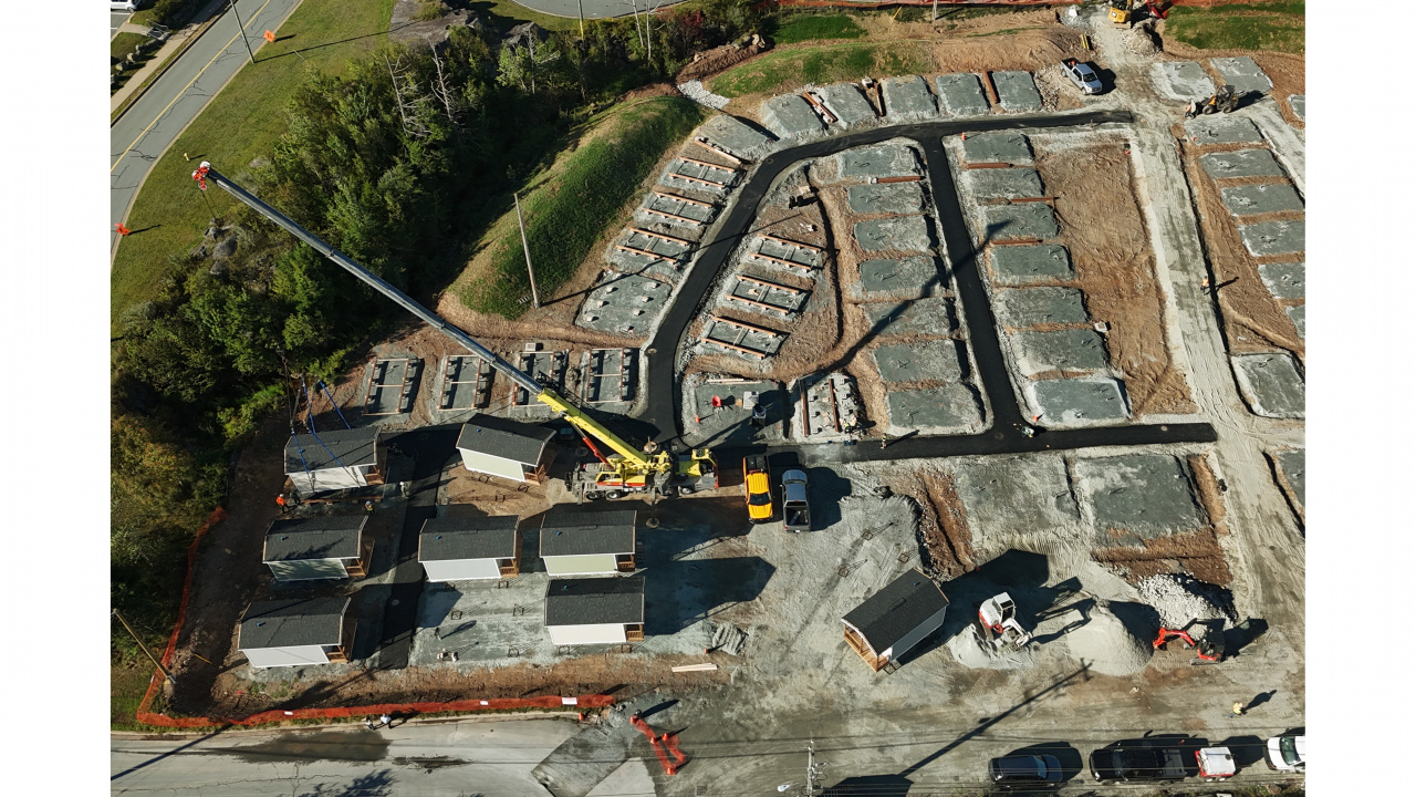 Aerial photo of crane installing tiny homes in Lower Sackville