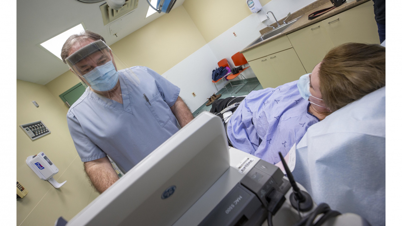 Photo of an ultrasound technician and patient