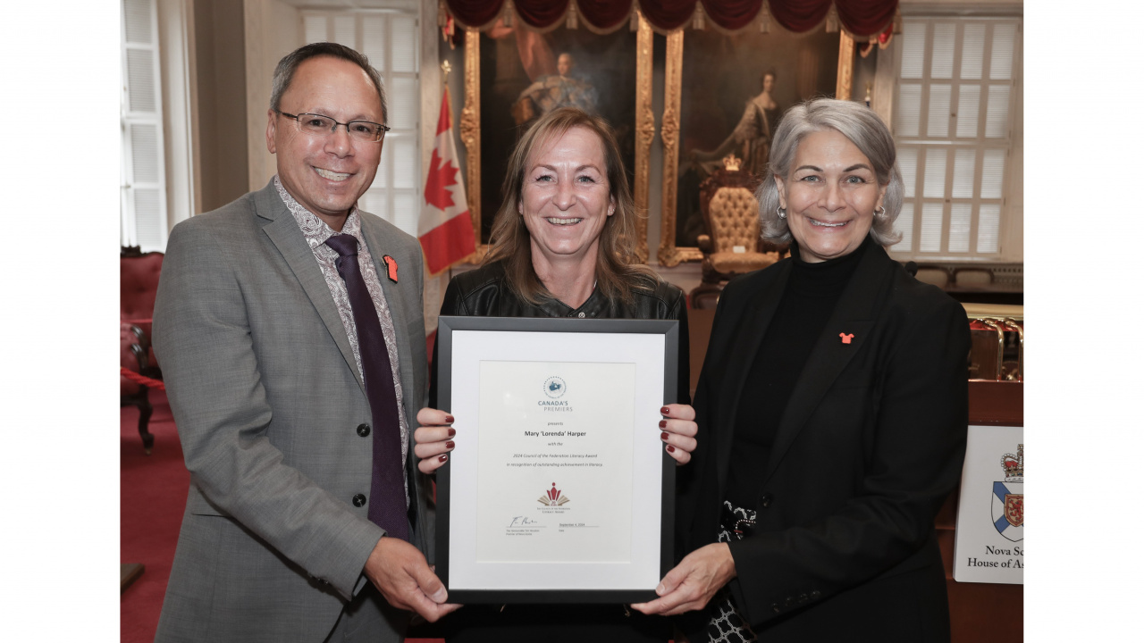 Photo of Advanced Education Minister Brian Wong, CoF Literacy Award recipient Lorenda Harper and Ava Czapalay, Deputy Minister of Labour, Skills and Immigration