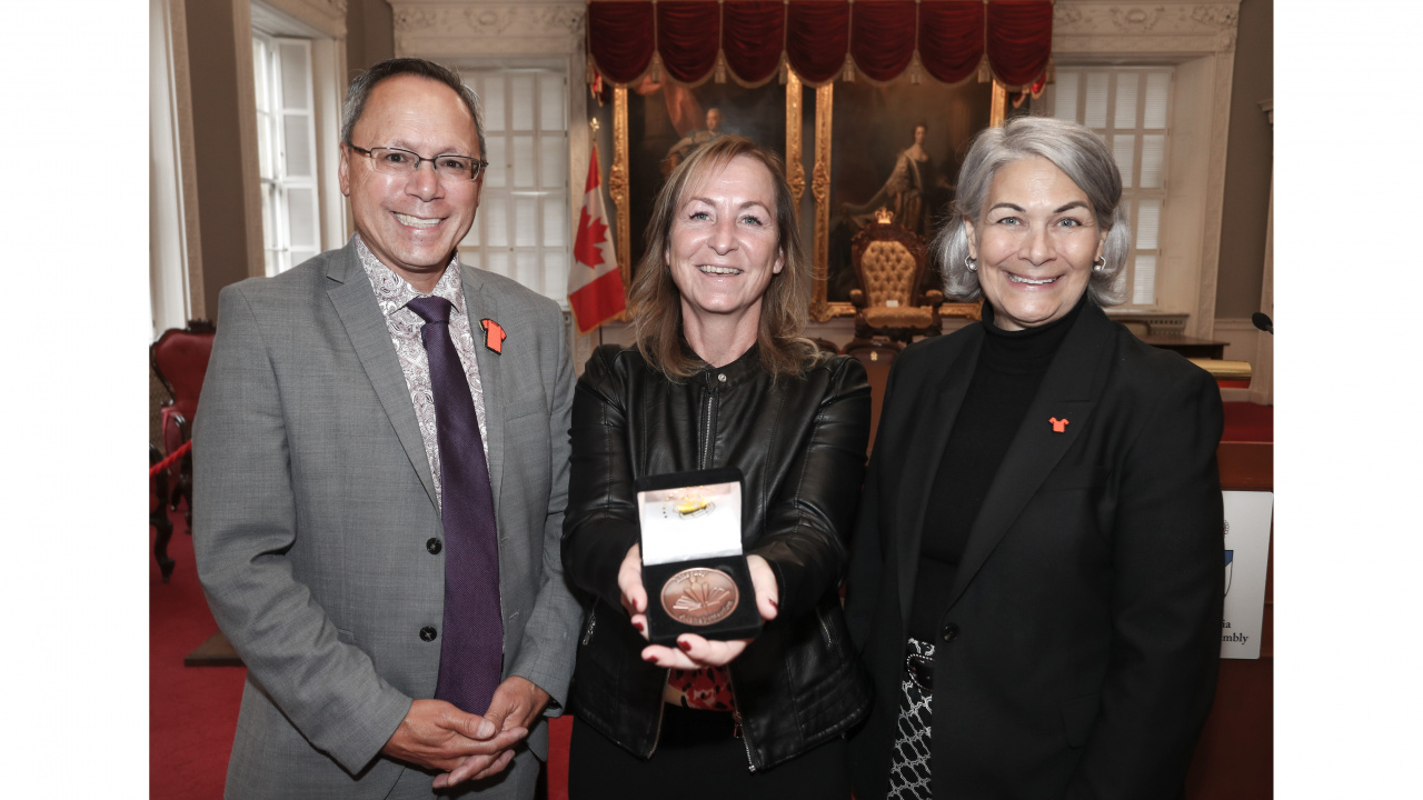 Photo of Advanced Education Minister Brian Wong, CoF Literacy Award recipient Lorenda Harper and Ava Czapalay, Deputy Minister of Labour, Skills and Immigration