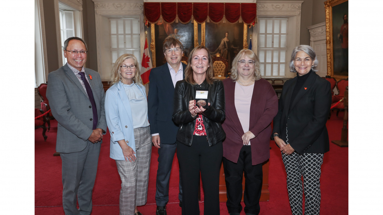 Photo of Advanced Education Minister Brian Wong, CoF Literacy Award recipient Lorenda Harper, Ava Czapalay, Deputy Minister of Labour, Skills and Immigration, and others