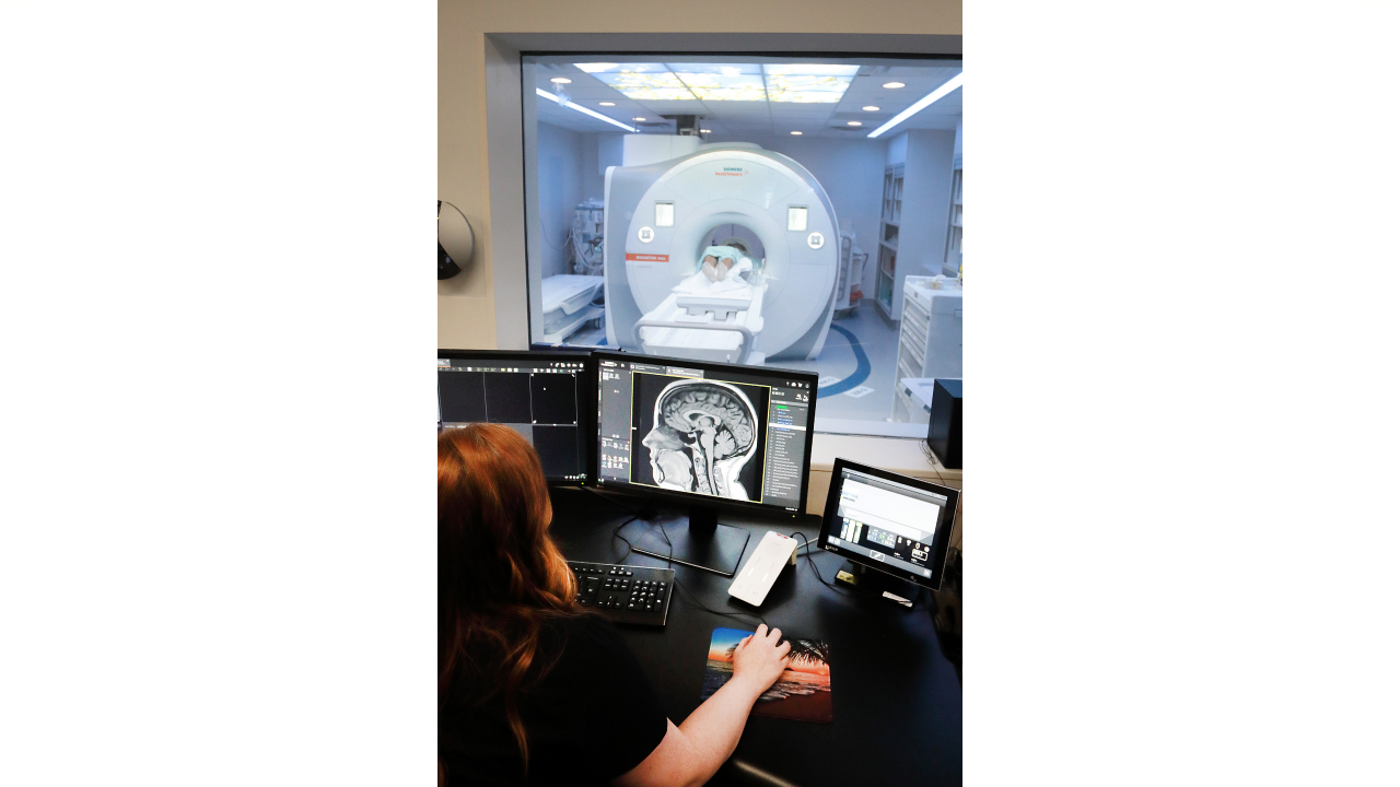 An MRI technologist in the control room of the new MRI suite at the QEII Health Sciences Centre as a patient is scanned in the new 1.5T MRI.