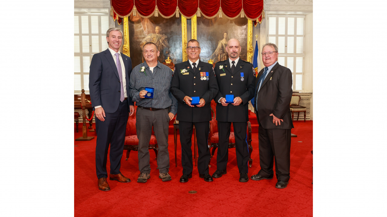 Photo of Premier Tim Houston; medal recipients Carl Comeau of Church Point, Carl Deveau of Saulnierville and Terrence Leblanc of Saulnierville; Tom Steele, Chair, Medal of Bravery Advisory Committee