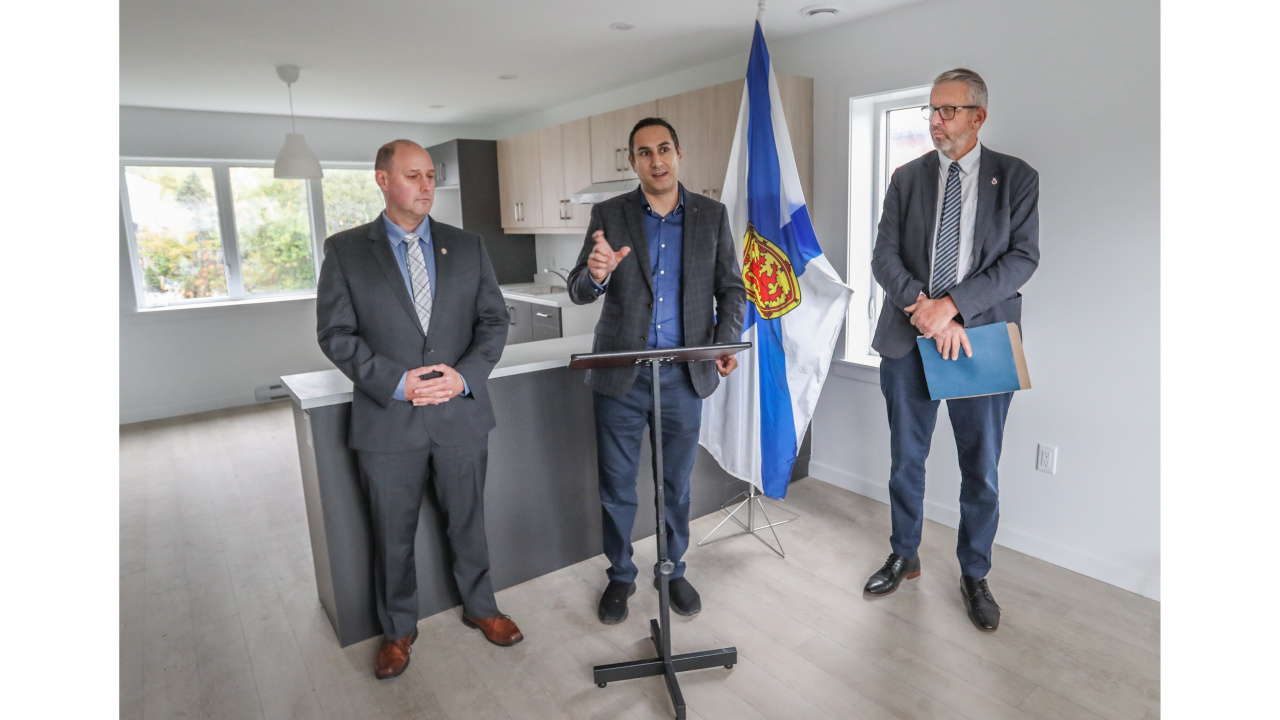 Minister Timothy Halman, Michael Kabalen and Minister John Lohr answer questions ay housing announcement