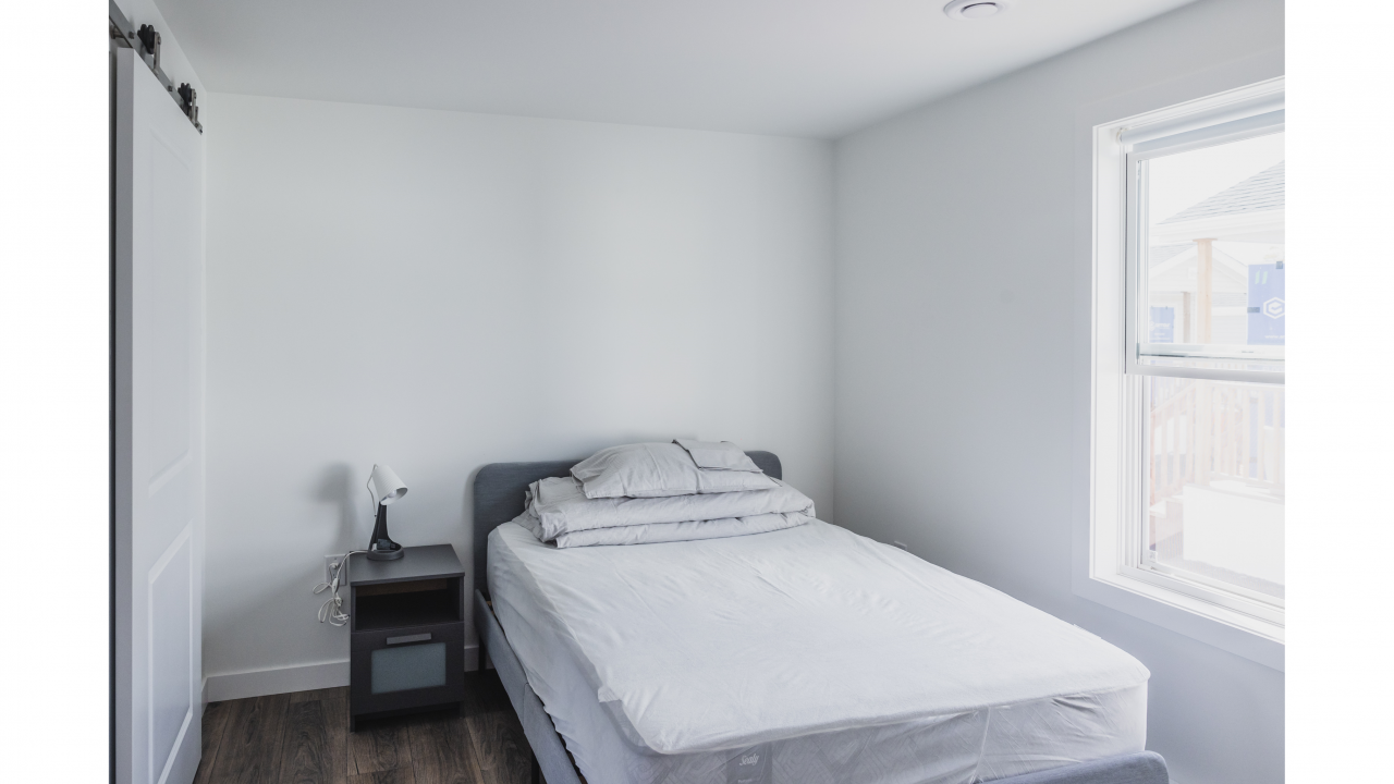 bedroom in tiny home community in sackville