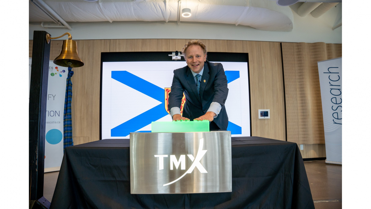 Deputy Premier Alan MacMaster opens the Toronto Stock Exchange from the Health Innovation Hub in Halifax today, October 8. (Province of Nova Scotia)