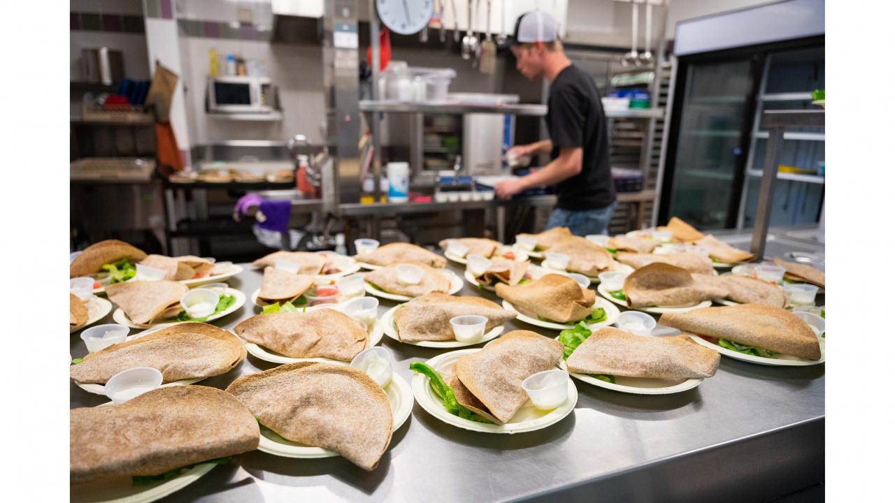 Photo of pitas on plates in a school kitchen