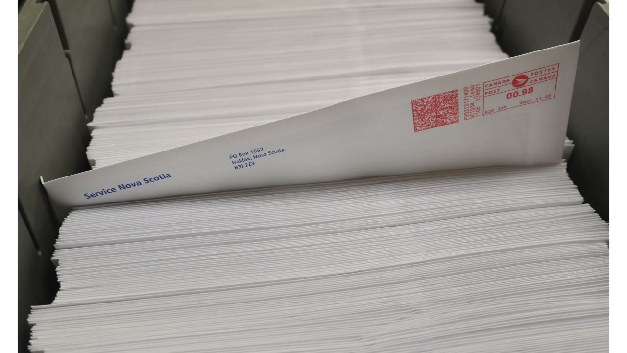 photo of a stack of government mail, with one envelope protruding