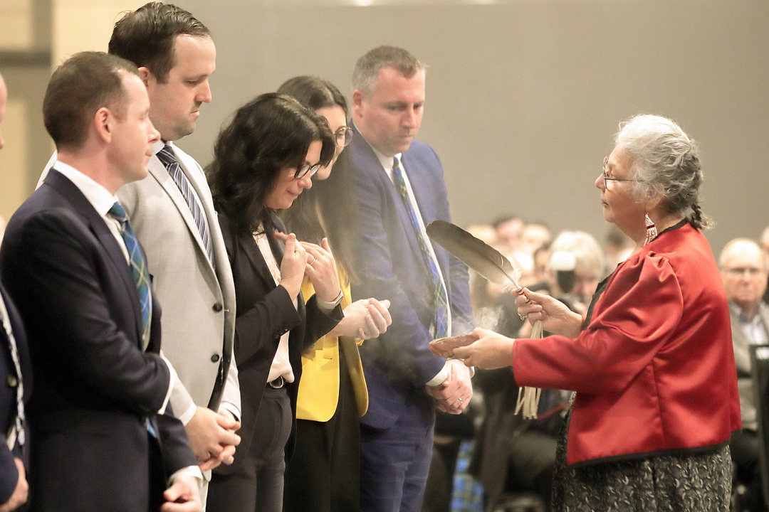 Elder Lorraine Whitman gives a smudging of the new cabinet at the swearing in ceremony held at the Halifax Convention Centre.