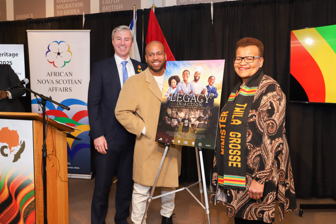 Photo of Premier Tim Houston, Paul Adams Jr. and African Nova Scotian Affairs Minister Twila Grosse with the African Heritage Month 2025 poster