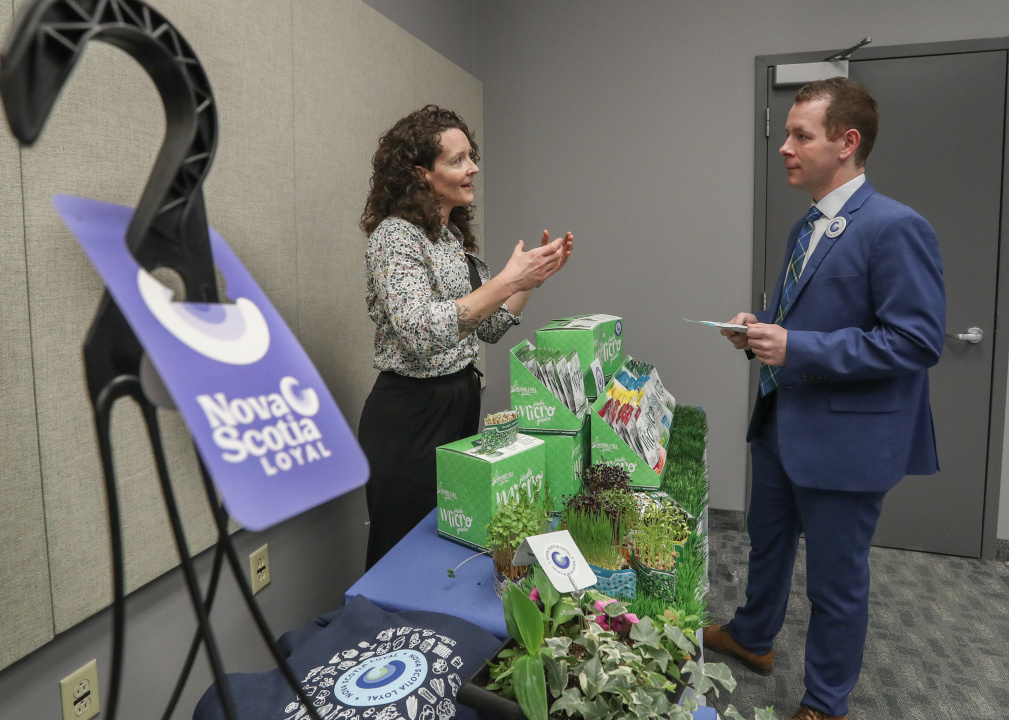 Growth and Development Minister Colton LeBlanc talks to a vendor of Nova Scotia products