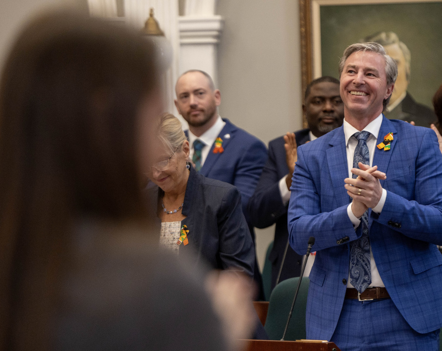 Premier Tim Houston applauds the throne speech