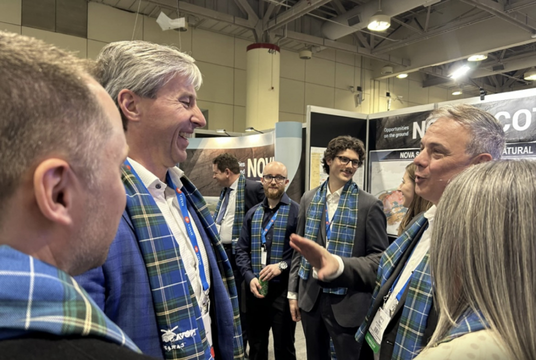 Premier Tim Houston speaks with mining company officials at a major international mining conference in Toronto.