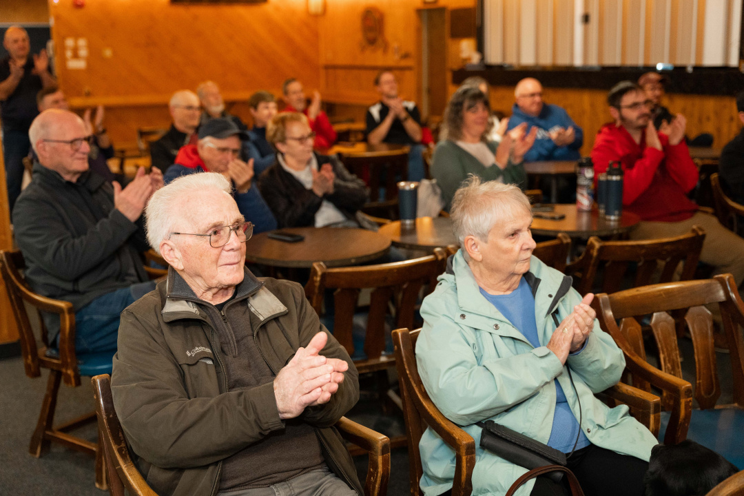 Elderly people applauding