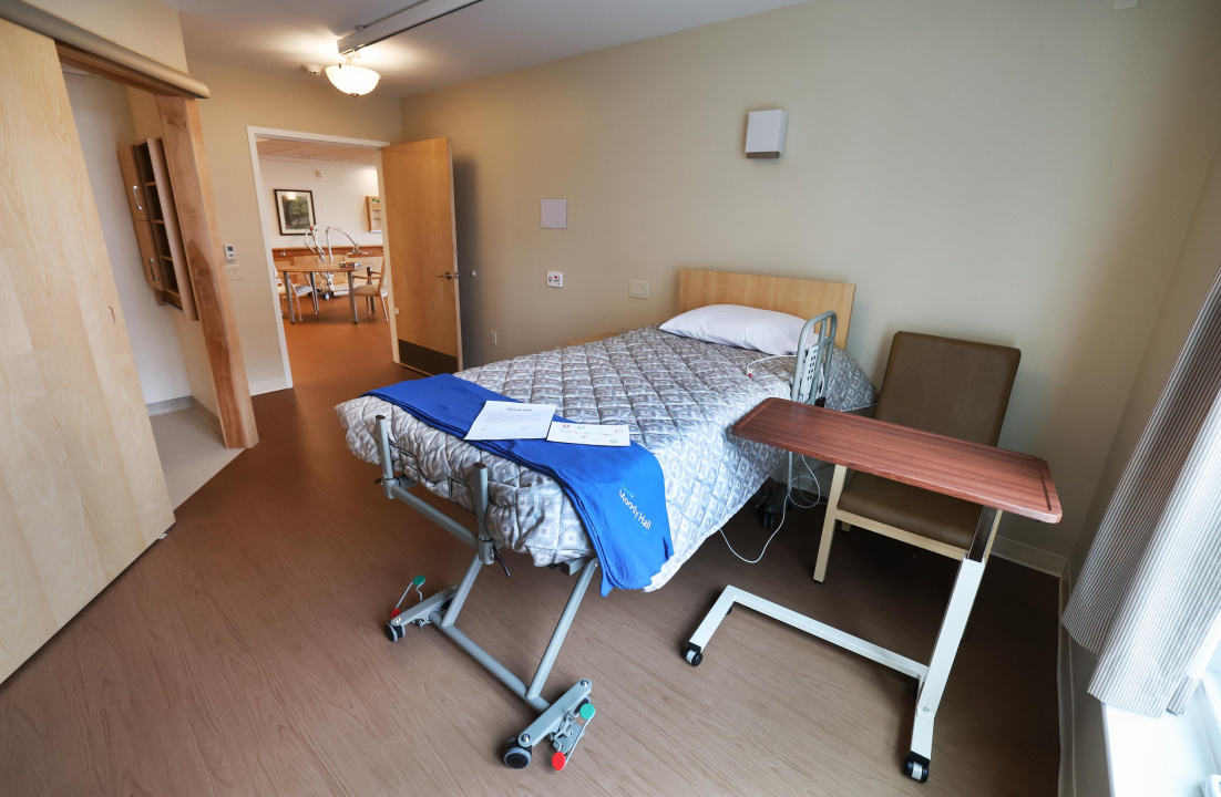 A bed in a room at a new long-term care home