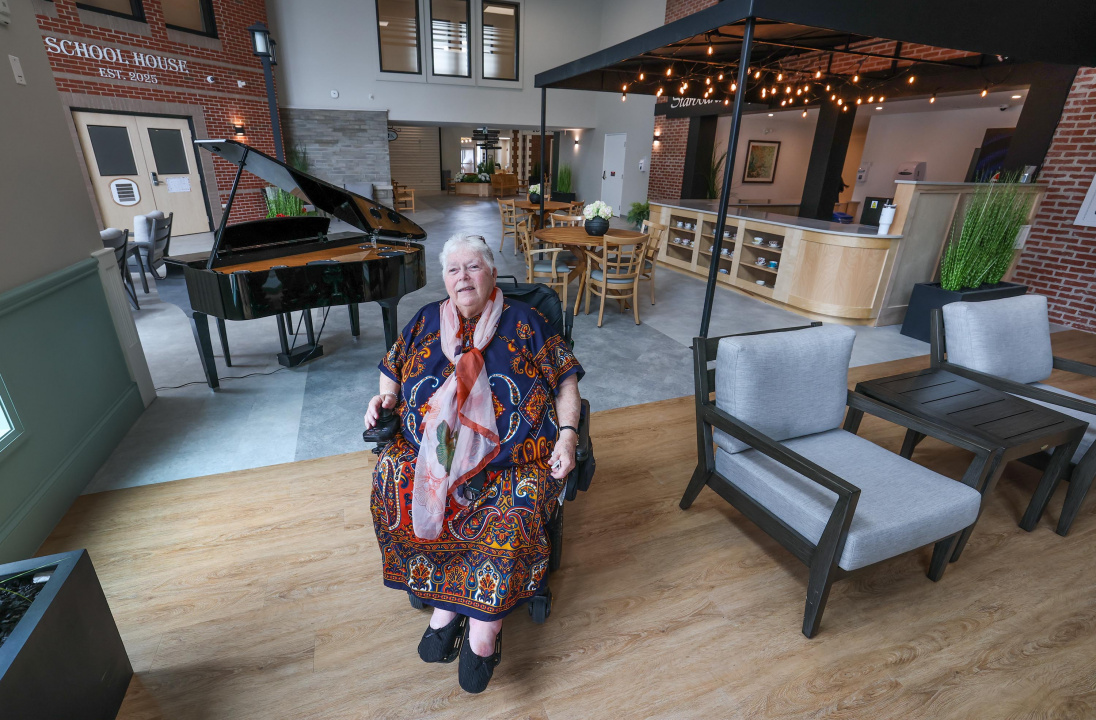A woman in a wheelchair in a long-term care home