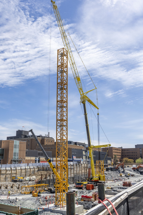 A mobile crane (right) is used to build a tower crane at the Halifax Infirmary/