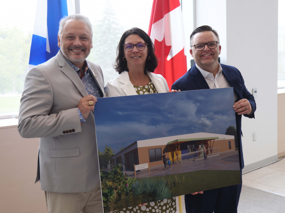 Andy Hakin, President of St FX; Michelle Thompson, Minister of Health and Wellness and MLA for Antigonish; and Brandan Maguire, Minister of Education and Early Childhood Development hold a rendering of the new child-care centre.