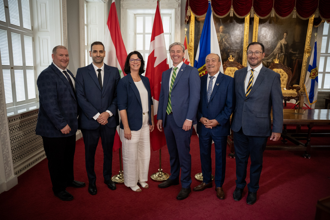 L-R: Nick Hilton, MLA for Yarmouth and Ministerial Assistant for Health and Wellness; Dr. Mohammad Srour; Michelle Thompson, Minister of Health and Wellness; Premier Tim Houston; Wadih Fares, Honorary Consul of Lebanon in Halifax; and Dr. Gus Grant, CEO and Registrar of the College of Physicians and Surgeons of Nova Scotia, at the announcement.