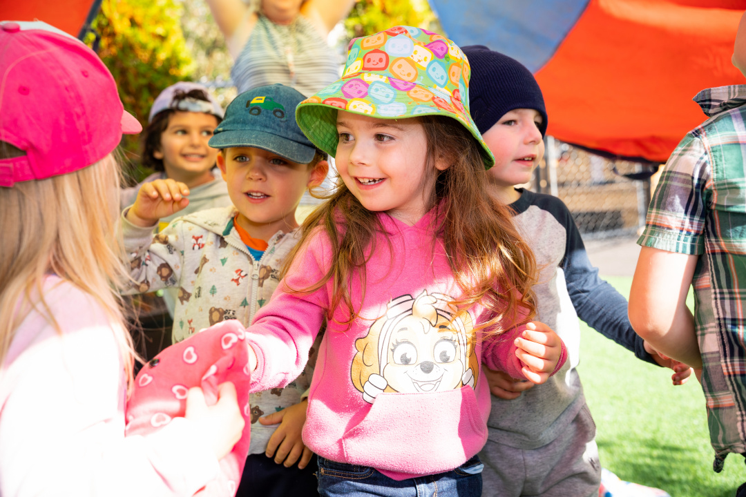 Young children playing outdoors.
