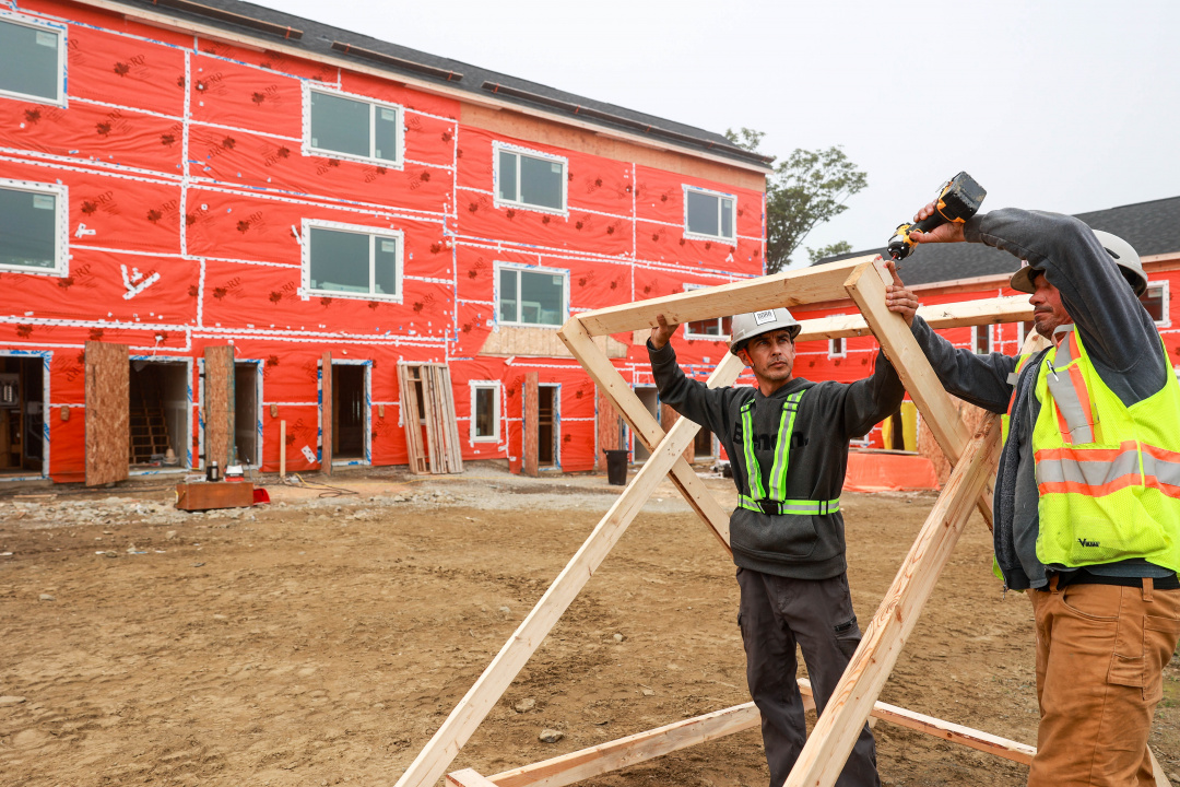 Construction workers at a housing site