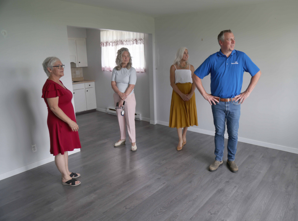 Agriculture Minister Greg Morrow in a housing unit during an announcement