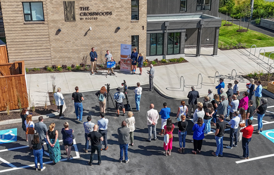 Aerial photo of people outside a building during an announcement