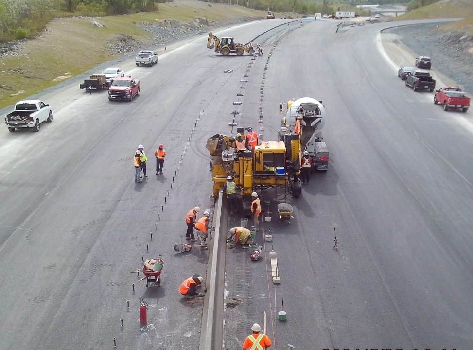 Workers paving a road