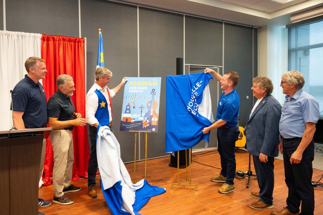 Kyle MacQuarrie MLA for Inverness, Senator Allister Surette, Premier Tim Houston, Colton LeBlanc, Minister of Acadian Affairs and Francophonie, Jules Chiasson, executive director of the Acadian Federation and Senator Réjean Aucoin