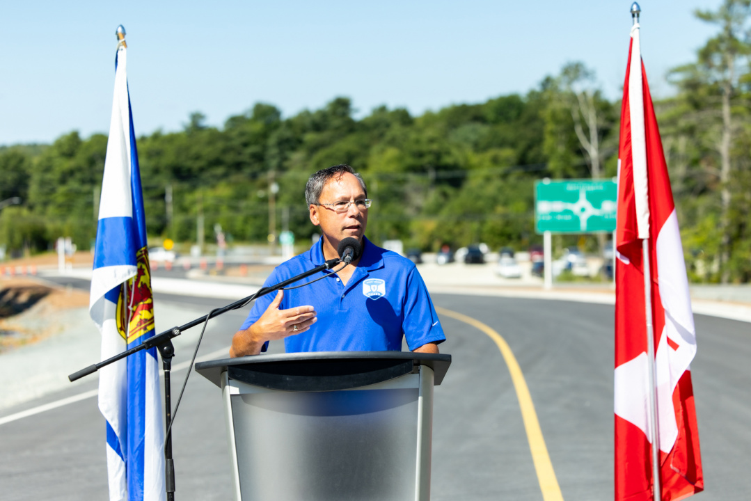 Brian Wong, MLA for Waverley-Fall River-Beaver Bank speaks at a podium at the opening of the Aerotech Connector.