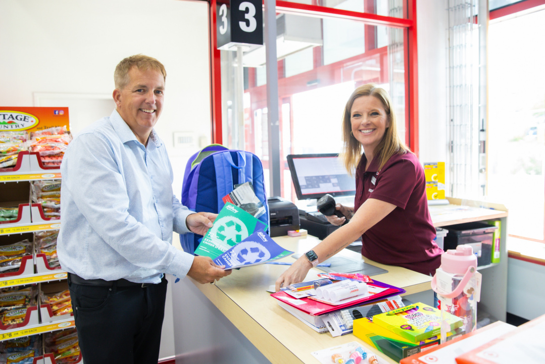 Scott Armstrong, Minister of Opportunities and Social Development joins Annette Latremouille, general manager at the Gottingen Street Staples, to pay for school supplies for families on income assistance at the Gottingen Street location