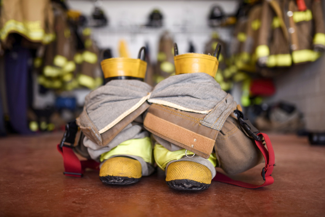 A firefighter's boots and overalls