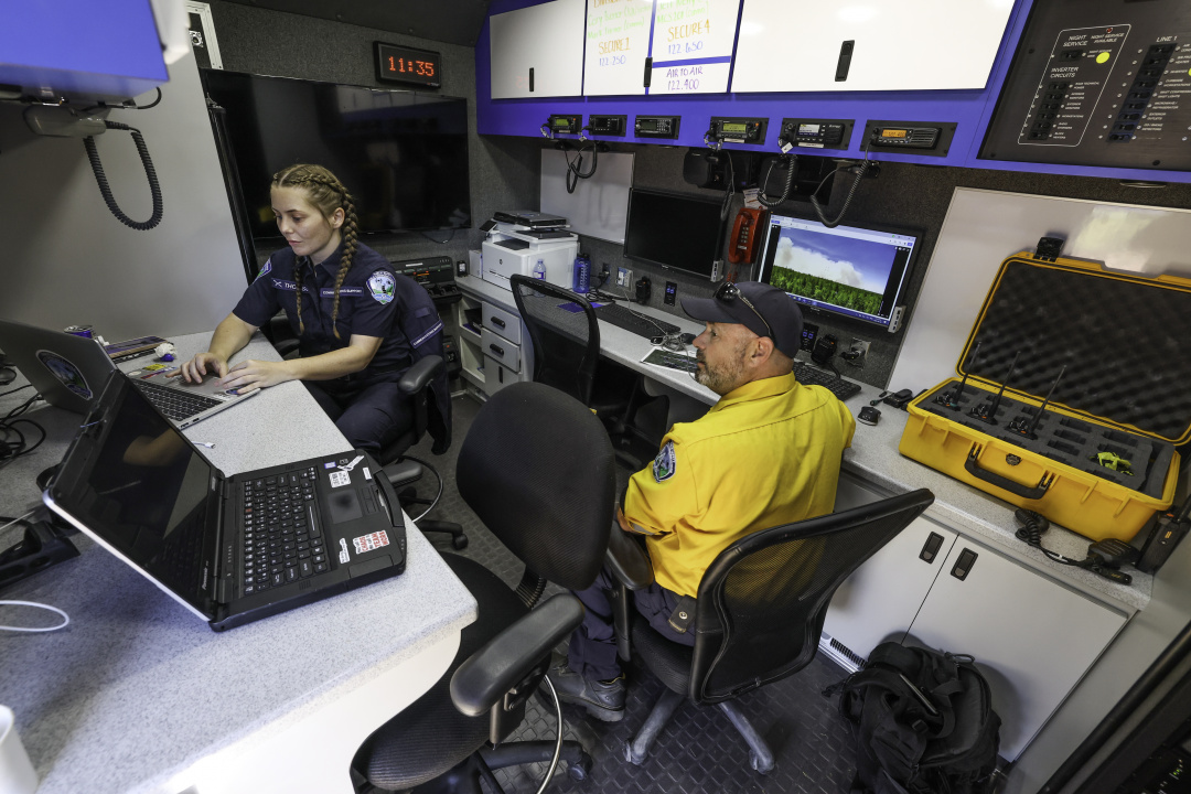Crew works in the mobile communications truck at the incident command post in West Dalhousie.