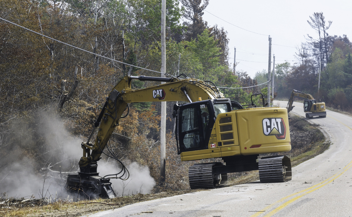 Excavators with grinding attachments, mulch the ditches in West Dalhousie.