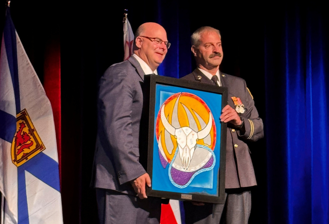 Communities, Culture, Tourism and Heritage Minister Dave Ritcey presents NS Strong Award - Mi'kmaw artwork - to Blaise Sampson