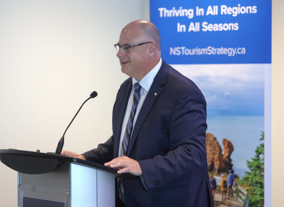 Dave Ritcey, MInister of Communities, Culture, Tourism and Heritage at a podium