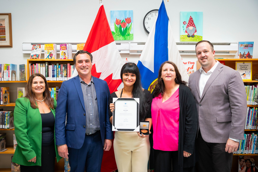 L-R: Kelly Campbell LeFort, acting Director, Adult Education, Labour Skills and Immigration; Minister Nolan Young; award recipient Mary Smith; Lisa MacDougall, Executive Director, Adult Learning Association of Cape Breton County; and Brian Comer, Minister of Addictions and Mental Health and MLA for Cape Breton East.