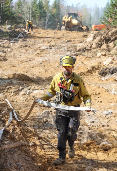 A firefighter in the woods