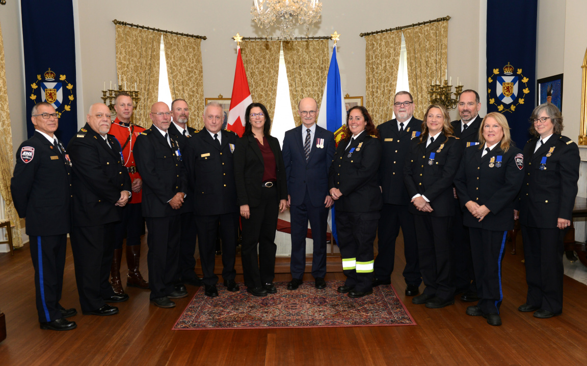 Recipients of the Emergency Medical Services Exemplary Service Medal pose for a photo at Government House